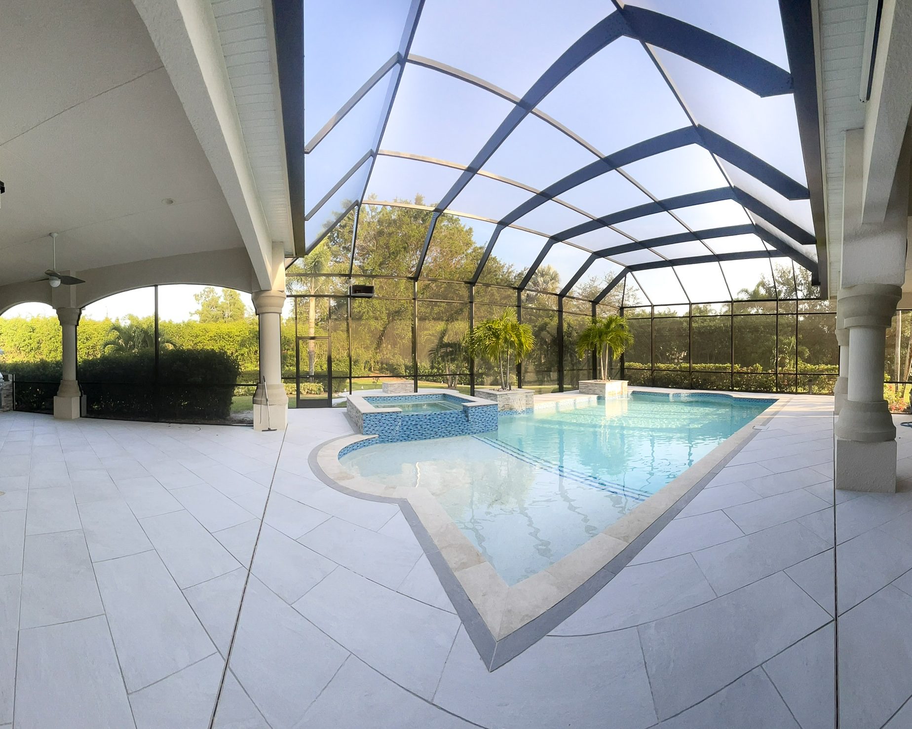 Indoor pool with glass roof in modern home